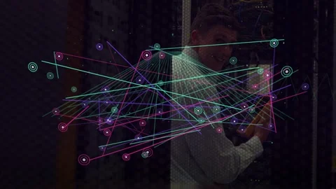 Vertical video: Tech holding orange phone, turning as overlay sweeping in, Stock Footage 332732337