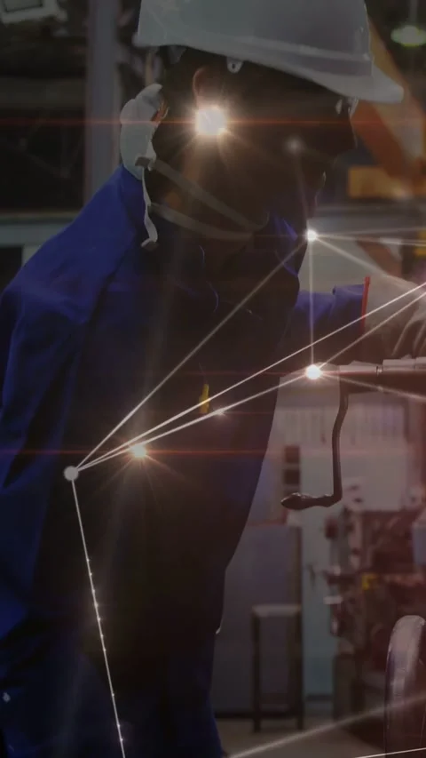 Vertical video: Tech inspecting, turning crank, aligning machine with light Stock Footage 333235933