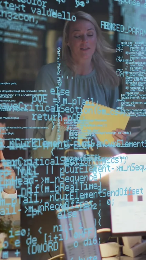 Vertical video: Tech lead entering, pointing at chart, transparent code over Stock Footage 333555966
