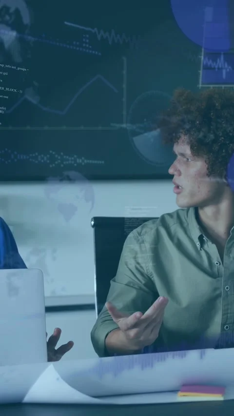 Vertical video: Tech lead pointing at laptop, peer replying, graphs and code Stock Footage 333303828