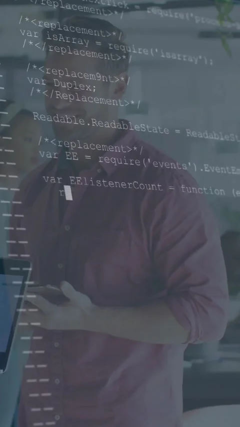 Vertical video: Tech man with phone looking at laptop causing code overlay Stock Footage 332278483