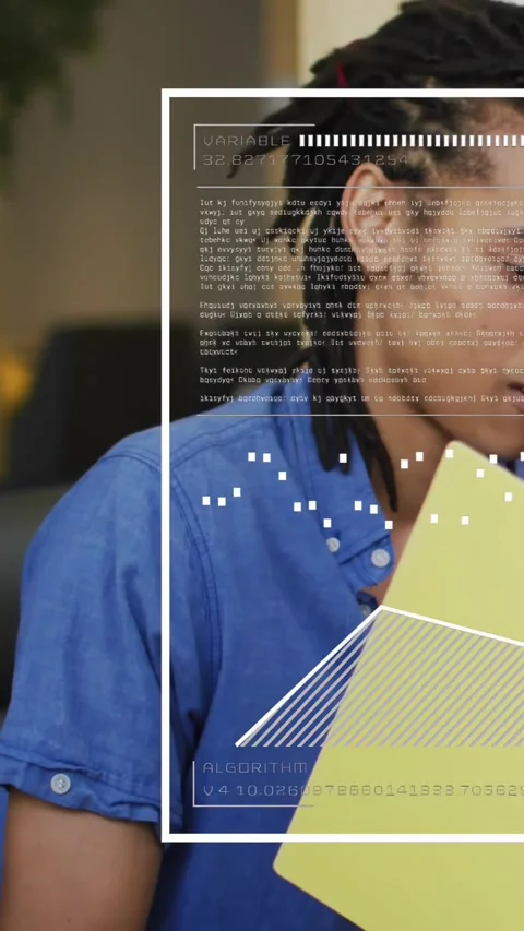 Vertical video: Tech man reading yellow folder superimposed UI overlay updating Stock Footage 334319313