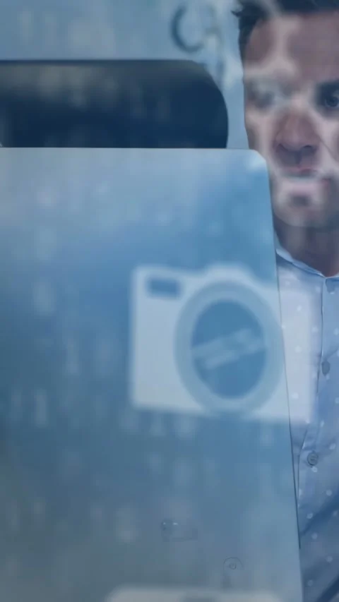 Vertical video: Tech man shifting by frost panel, camera icon flickering causing Stock Footage 334602890