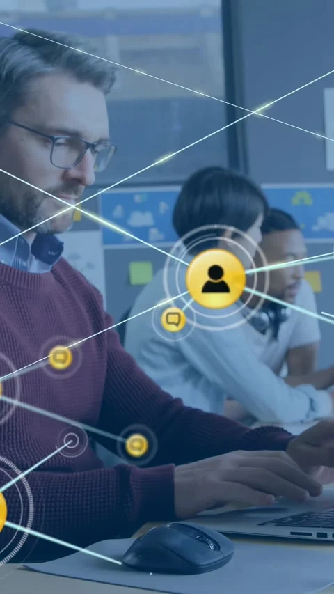 Vertical video: Tech man typing PC, pulsing icon sparking chat network over Stock Footage 330395542