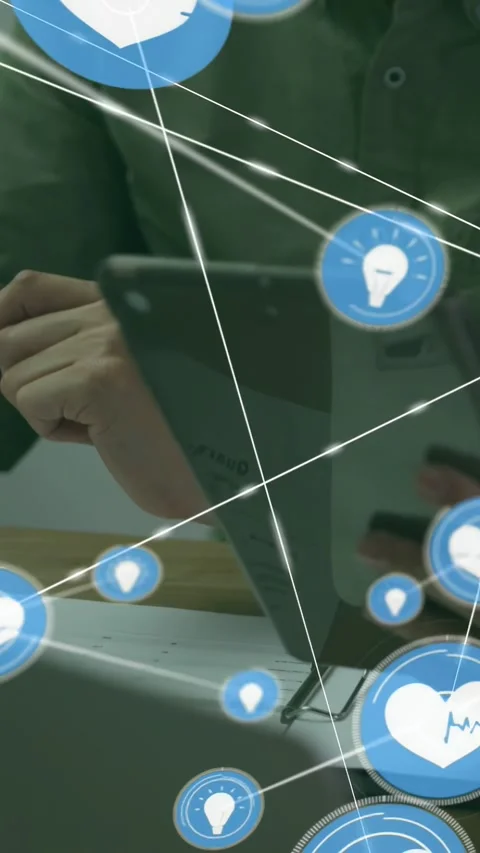 Vertical video: Tech manager picking up tablet and tapping, starting blue icon Stock Footage 333157423