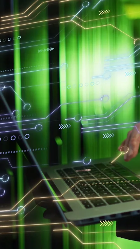 Vertical video: Tech placing hands on laptop starting typing circuit showing Stock Footage 332984858