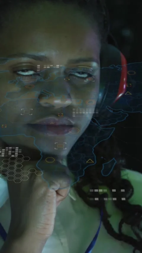 Vertical video: Tech reacting to alert HUD overlaying face fist under chin Stock Footage 334187256