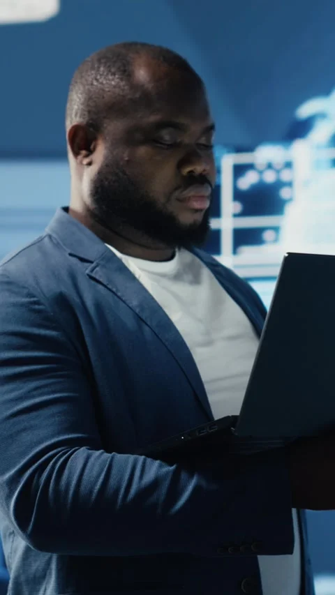 Vertical Video Tech savvy black engineer working with AI brain data Stock Footage 312177402