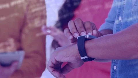 Vertical video: Tech staff tapping smartwatch after camera cutting, testing Stock Footage 334312746