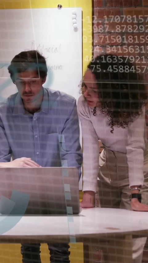 Vertical video: Tech team checking data woman reaching laptop man pointing Stock Footage 333528164