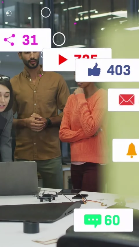 Vertical video: Tech team reviewing prototype on laptop, sticky blur revealing Stock Footage 334317525
