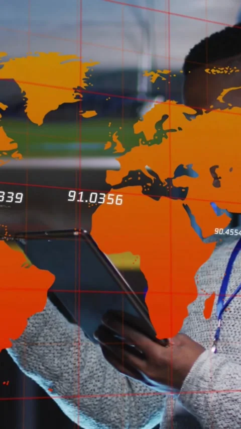 Vertical video: Tech tilting tablet and tapping, causing orange map coords to Stock Footage 334544052