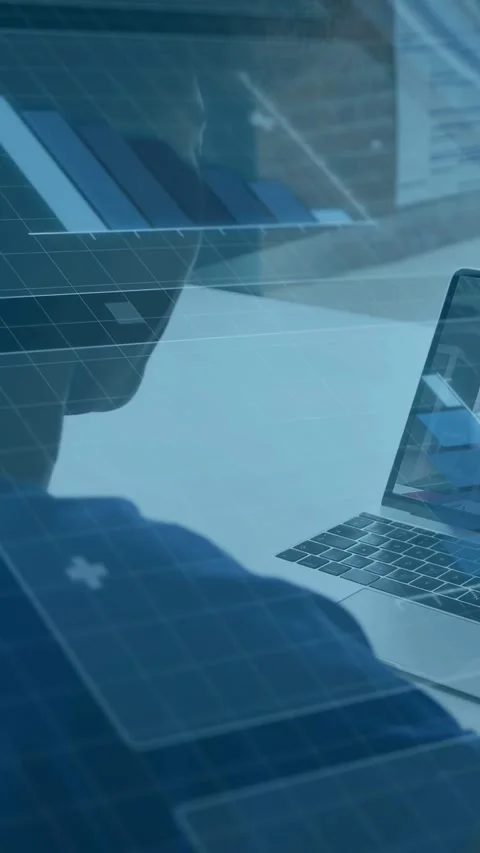 Vertical video: Tech user watching laptop changing, overlaying grid and bar Stock Footage 333157298