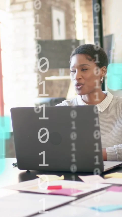 Vertical video: Tech woman gesturing offscreen causing teal bits overlay while Stock Footage 333496634