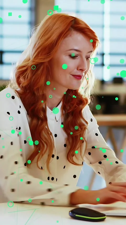 Vertical video: Tech worker clicking mouse, green icons floating on clicks and Stock Footage 333596337