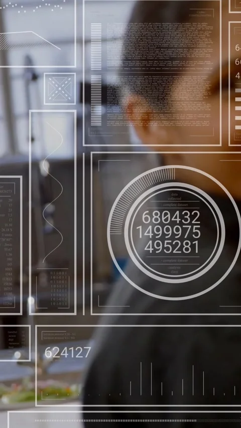 Vertical video: Tech worker leaning right checking HUD metrics while live data Stock Footage 331721045