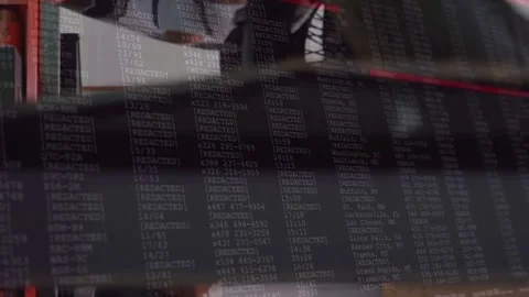 Vertical video: Tech wrenching wheel on lift, camera sliding revealing code Stock Footage 331635379