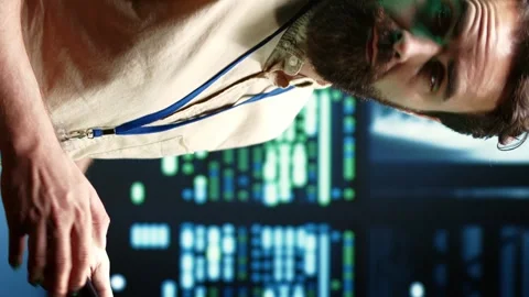 Vertical video Technician fixing VPN servers Stock Footage 245953494