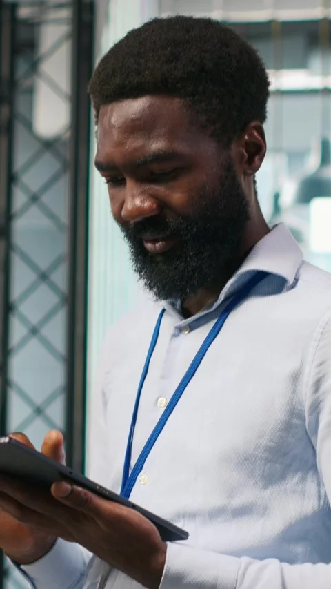 Vertical video Technician next to office coworkers developing AI software Stock Footage 312709318