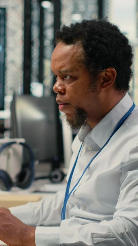 Vertical video Technician in office solving tasks with artificial intelligence Stock Footage 323142116