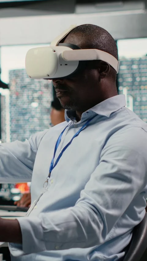 Vertical video Technician in office using VR headset equipment to accelerate AI Video stock 323330014