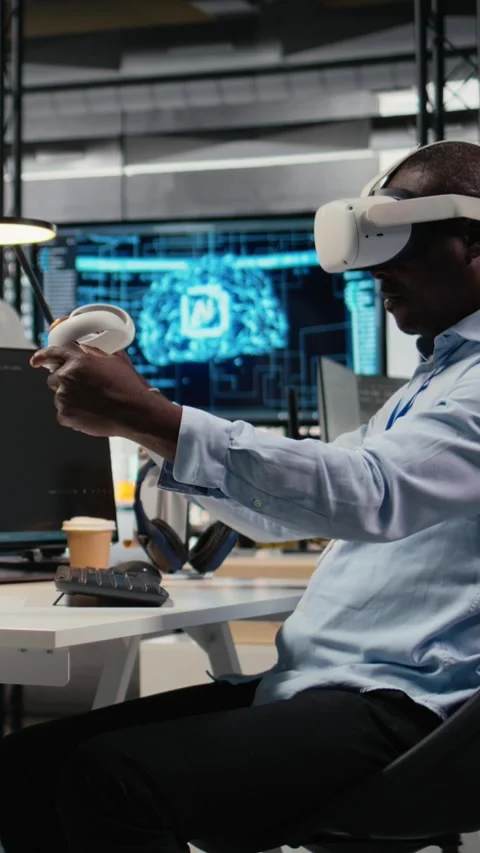 Vertical video Technician in office using VR headset equipment to accelerate AI Video stock 323403459