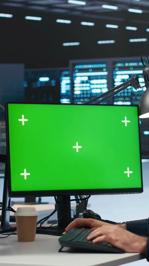 Vertical video Technician overseeing server room, running code on green screen Stock Footage 274680904