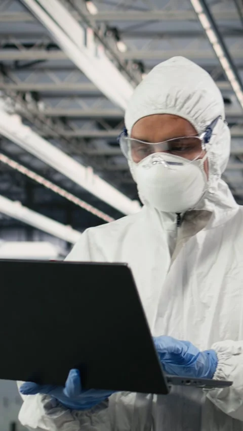 Vertical video Technician in semiconductor production plant facility using Video stock 333614831