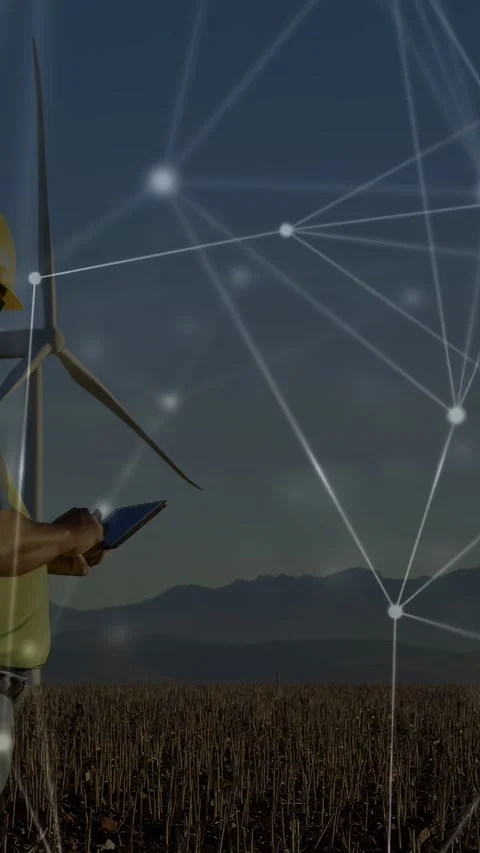 Vertical video: Technician tapping tablet at wind farm running network overlay Stock Footage 333451167