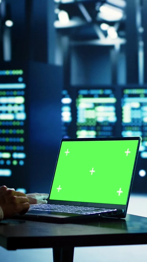 Vertical video Technician uses chroma key laptop for AI Stock Footage 249079039