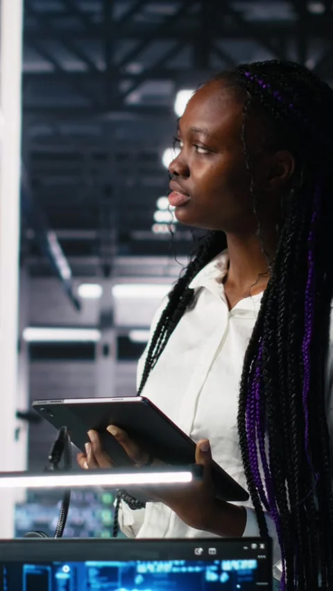 Vertical video Technicians in high tech data center cooperate on neural network Stock Footage 313507408