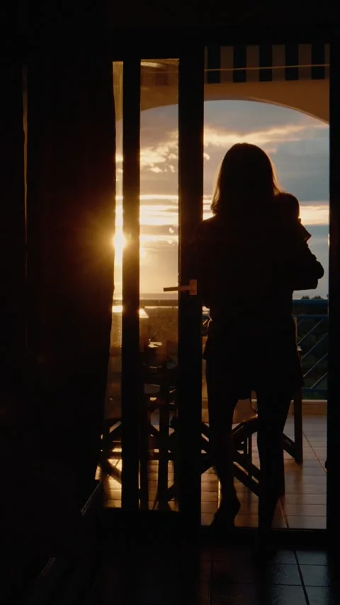 Vertical video Tenderness between mother and son admiring sunset at the balcony Stock Footage 303696738