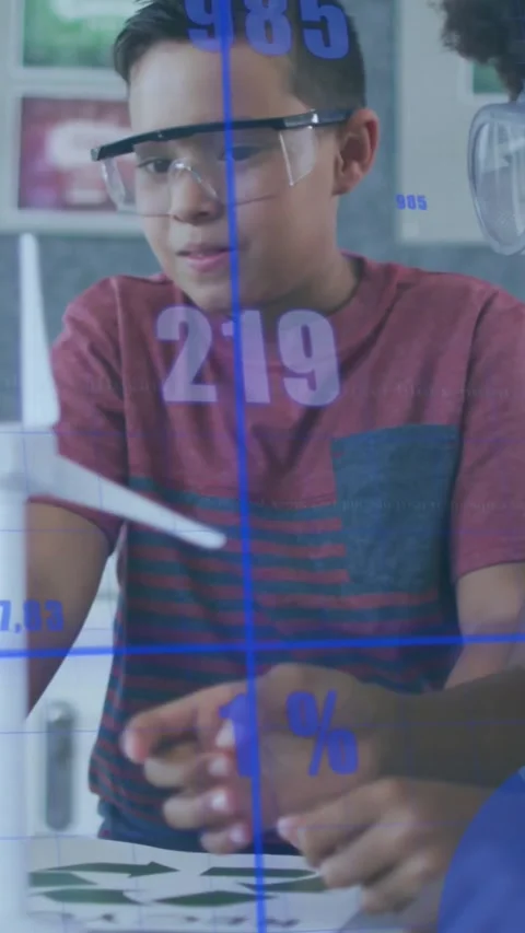 Vertical video: Testing boy in maroon with goggles guiding turbine blade in lab, Stock Footage 331431510