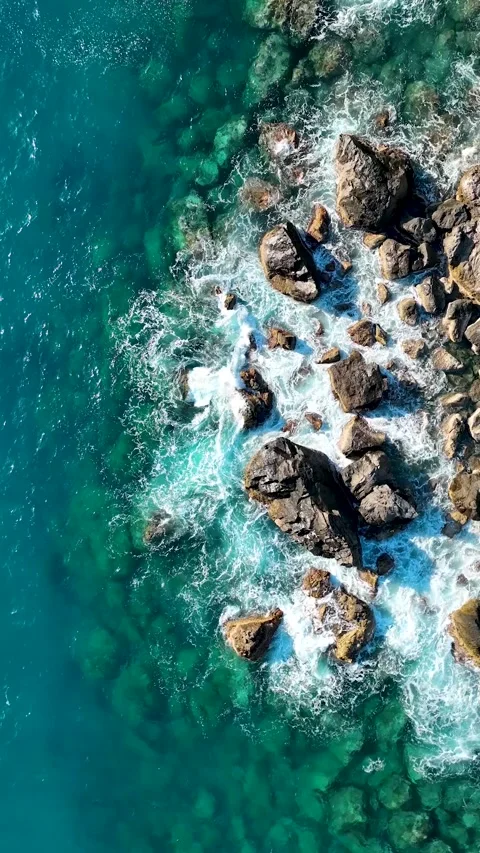 Vertical video Texture of the sea and wild beach aerial view Stock Footage 222438983