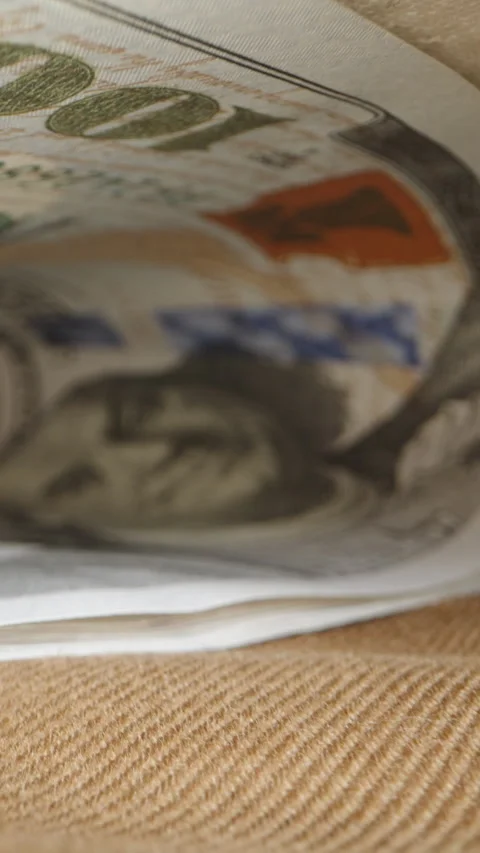 Vertical video. There is a stack of one hundred dollar bills in the pocket of my Stock Footage 247991158