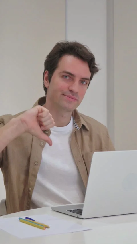 Vertical Video, Thumbs Down by Young Creative Man Working in,fice Stock Footage 318044900