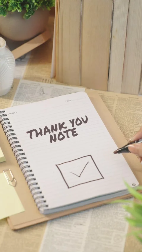 VERTICAL VIDEO OF TICKING OFF THANK YOU NOTE FROM CHECKLIST Video stock 308086053