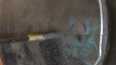 Vertical video. Tile glue is mixed with an electric drill in a bucket. Stock-Footage 267566479