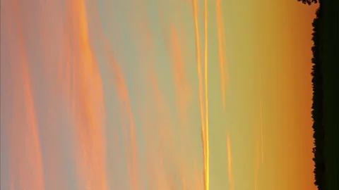 Vertical video Time laps sunset in the field sky in reflections with running Stock Footage 156971219