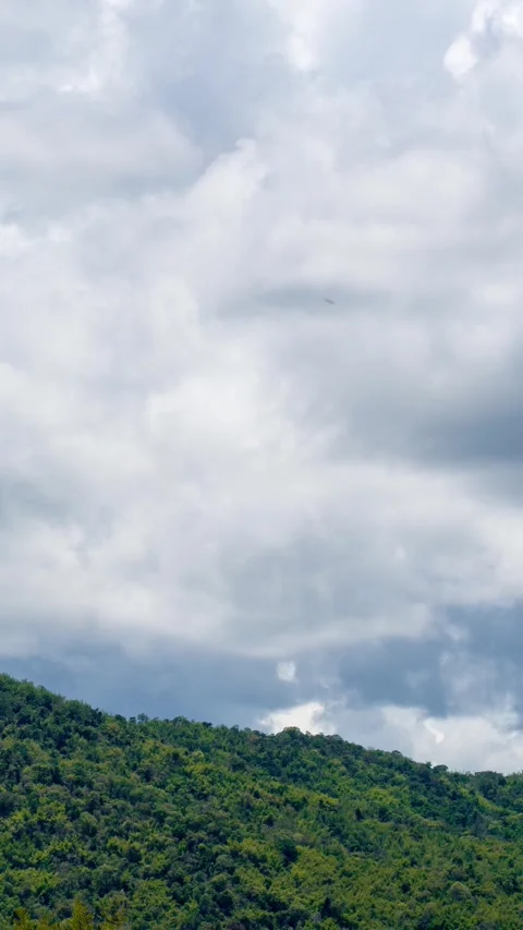 Vertical video time lapse of cloudy sky with mountains. Stock Footage 310034417