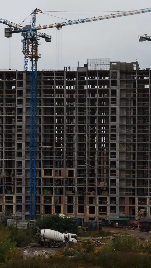 Vertical video time lapse of large highrise construction site with tower cran Stock Footage 321819714