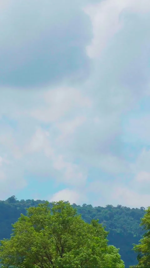 Vertical video, Timelapse Beautiful view of a mountain view with moving clouds Stock Footage 282569530
