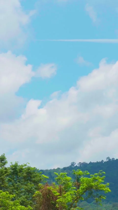 Vertical video, Timelapse Beautiful view of a mountain view with moving clouds Stock Footage 282569532
