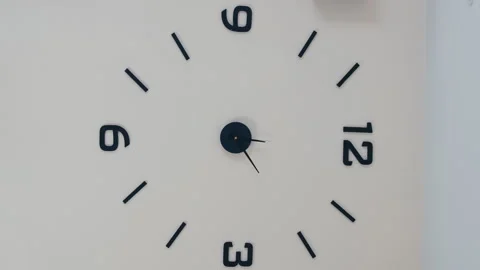 Vertical video timelapse countdown of white wall clock with black numbers. Watch Stock Footage 247116353