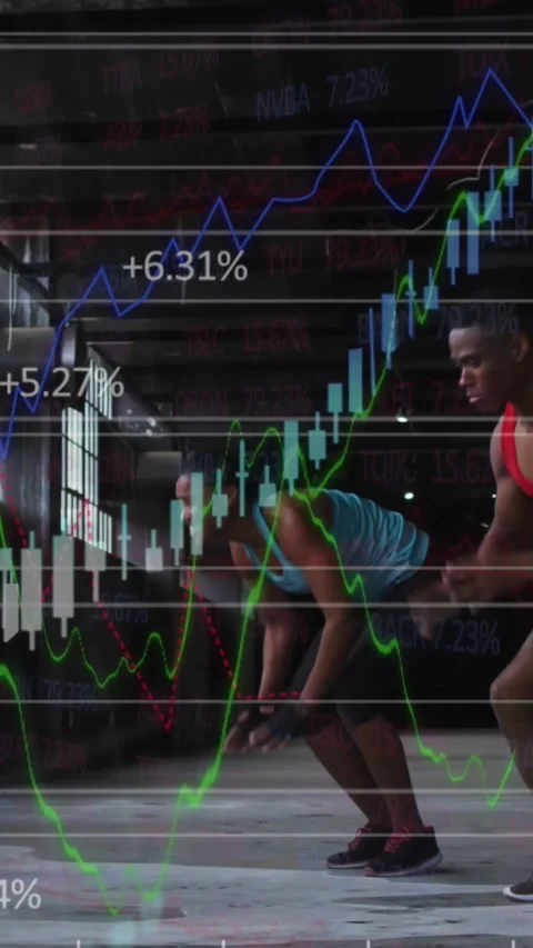 Vertical video: Timer starting training duo doing burpees in gym, finance charts Stock Footage 330581150