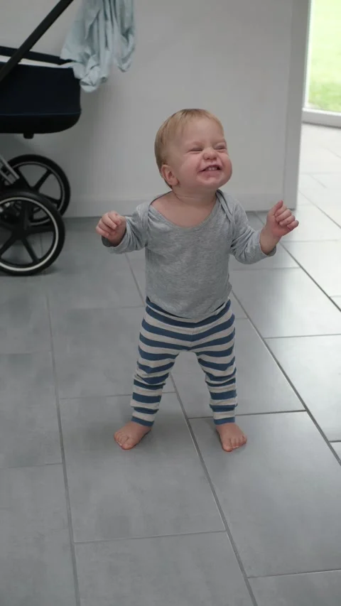 Vertical video Toddler first steps Stock Footage 293639758