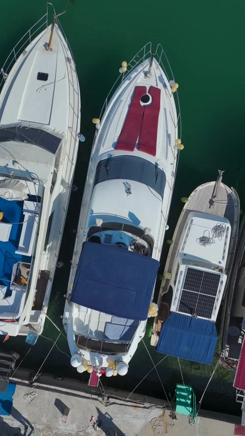 Vertical Video Top Down Harbor with Boats and Coastal City Elements Stock Footage 341737388