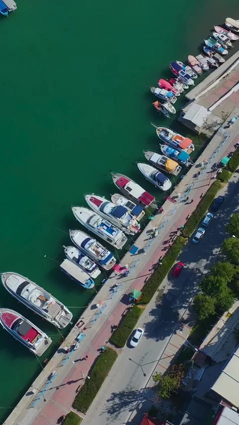 Vertical Video Top Down Marina with Yachts and Emerald Water Background Stock Footage 341739327
