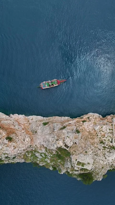 Vertical Video Top Down Shot of Ocean Patterns Around Moving Boat Stock Footage 342032114