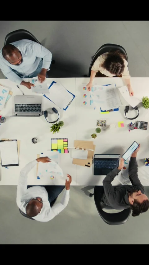 Vertical Video Top down view of employees consulting with executive management Stock Footage 321781646
